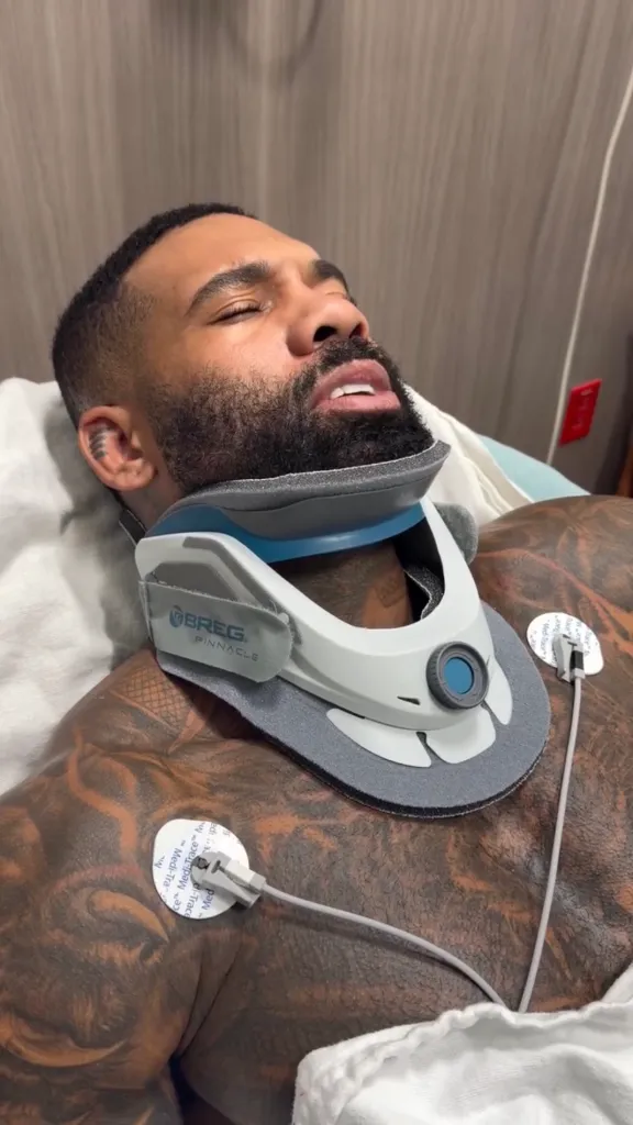 Holston — posted a photo of himself lying on a hospital gurney with his right leg wrapped in bandages and wearing a neck brace
